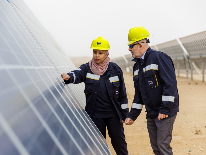Tunisian woman and man workers check solar panel