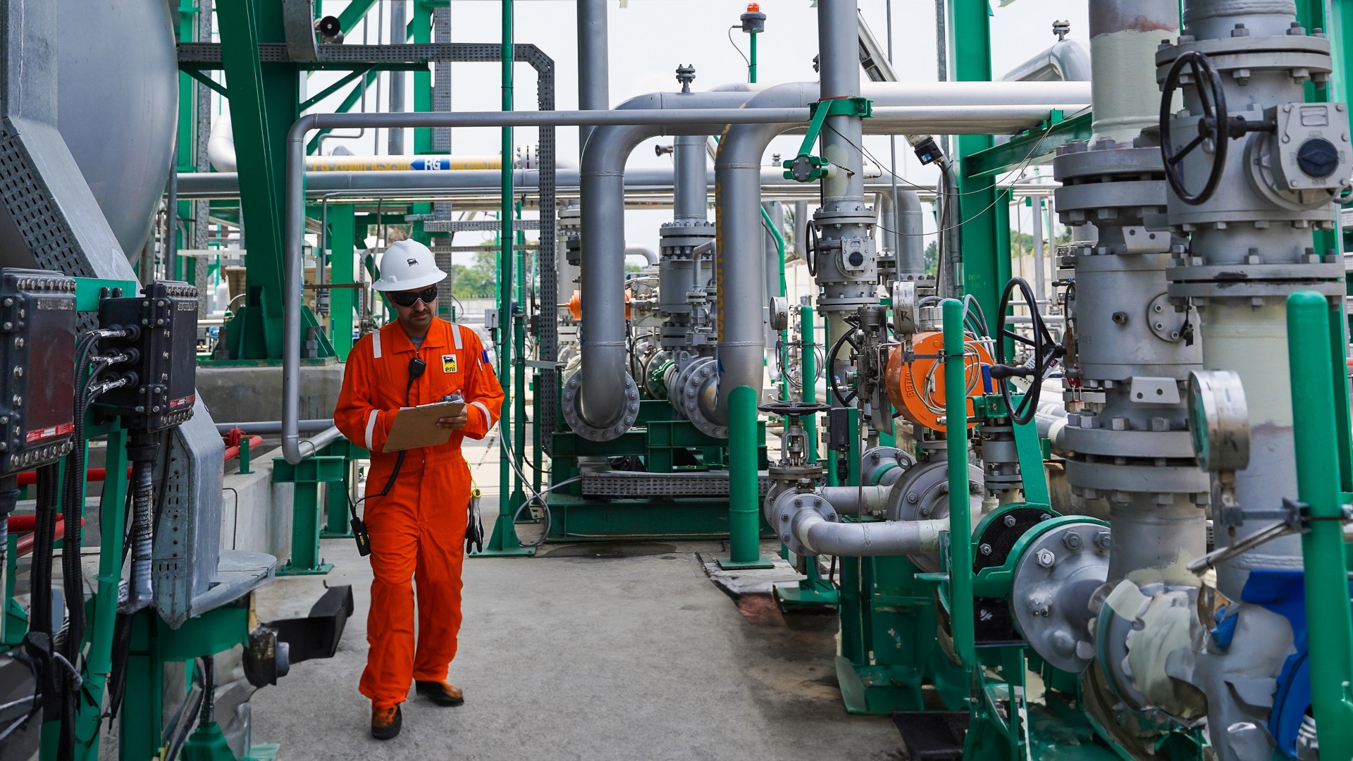 Worker controls walk in gas plant 