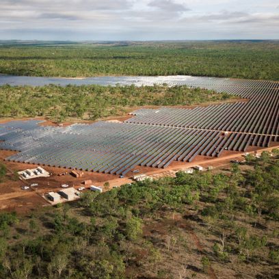 Solar panels on Australian soil surrounded by green nature