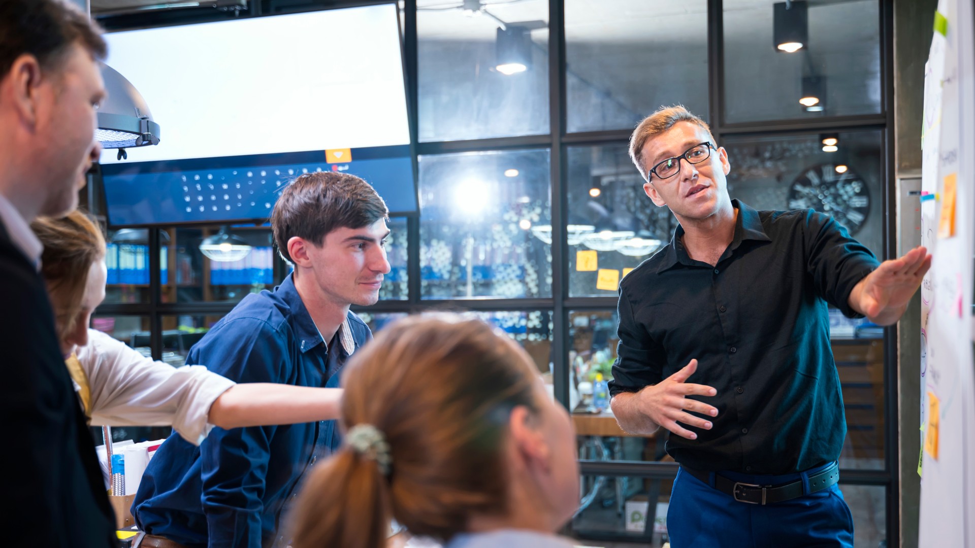 Young work team faces off in meeting