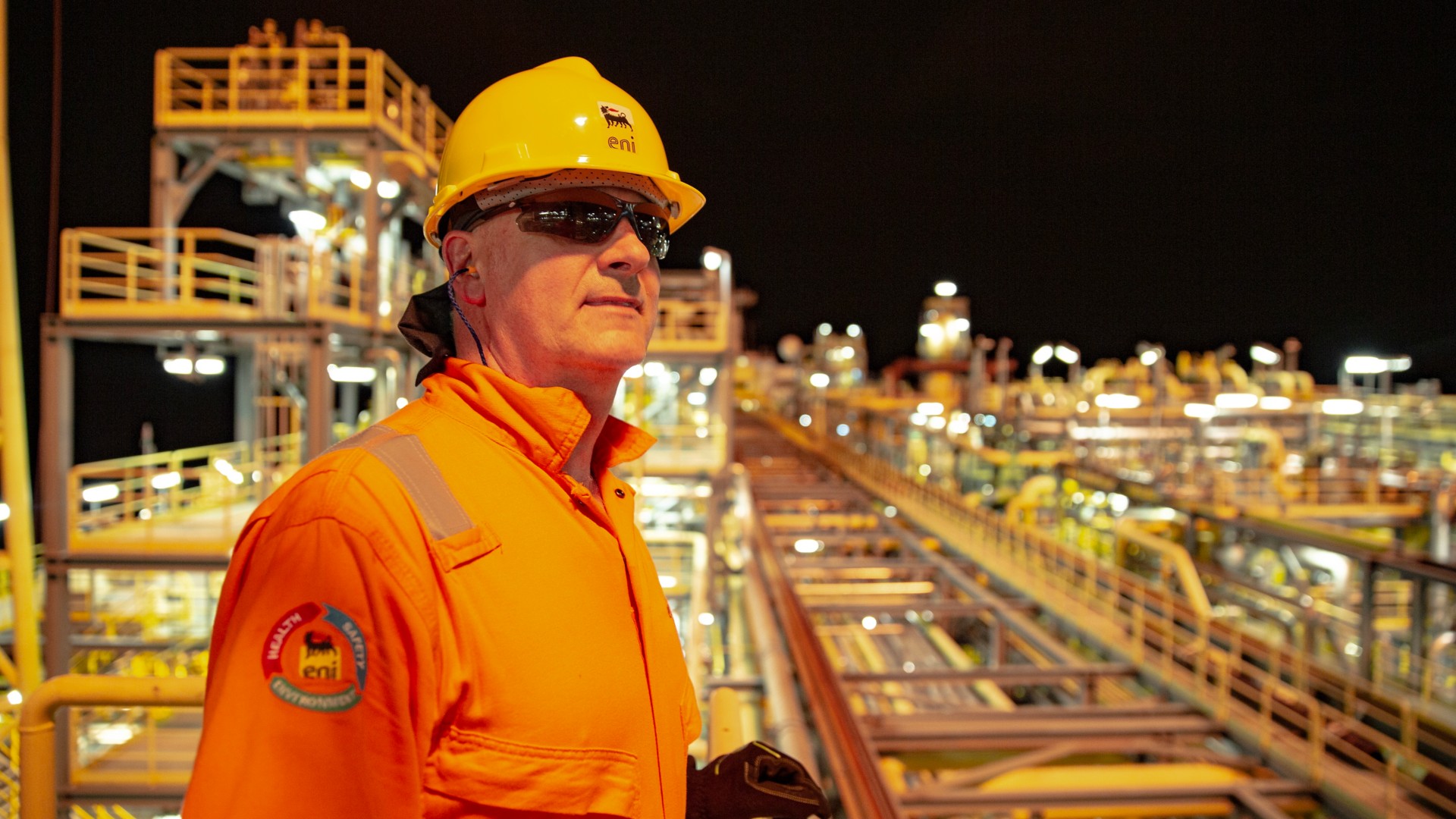 Worker on board the platform at night