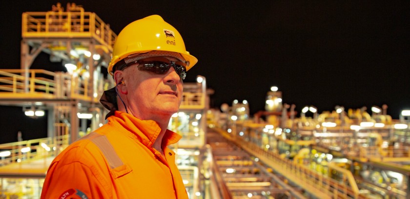 Worker on board the platform at night