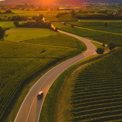 Natural landscape with road and hills at sunset