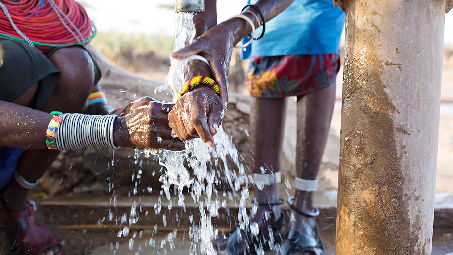 Detail of African hands washing their hands