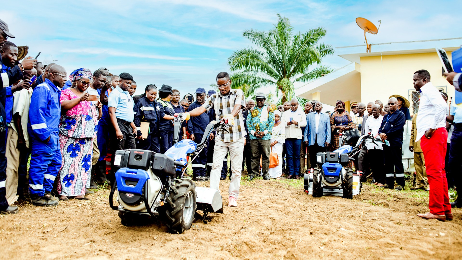 motorized plow operation demonstration in front of the community