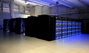 Data center with server racks illuminated by blue lights.
