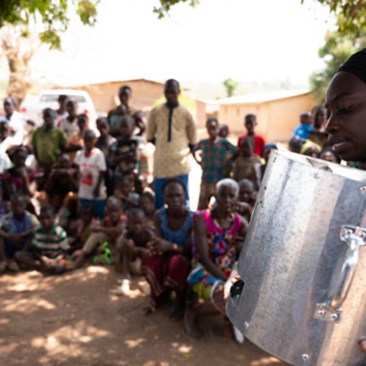 Woman holds a cooking system in her hand