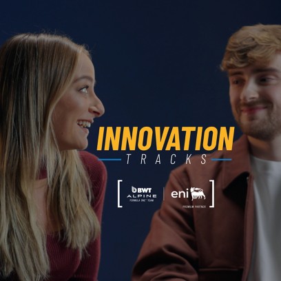 Two young people sitting and smiling while talking, with the “Innovation Tracks” logo centered on the image.