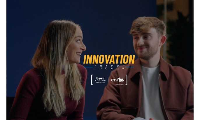 Two young people sitting and smiling while talking, with the “Innovation Tracks” logo centered on the image.