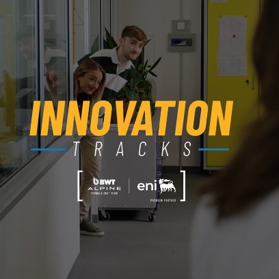 Three people peek out from a lab doorway while another stands in the foreground; overlaid text reads ‘Innovation Tracks.