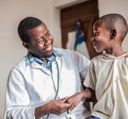 African male doctor examining child