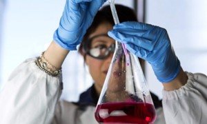 Scientist in lab with test tube