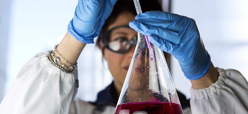 Scientist in lab with test tube