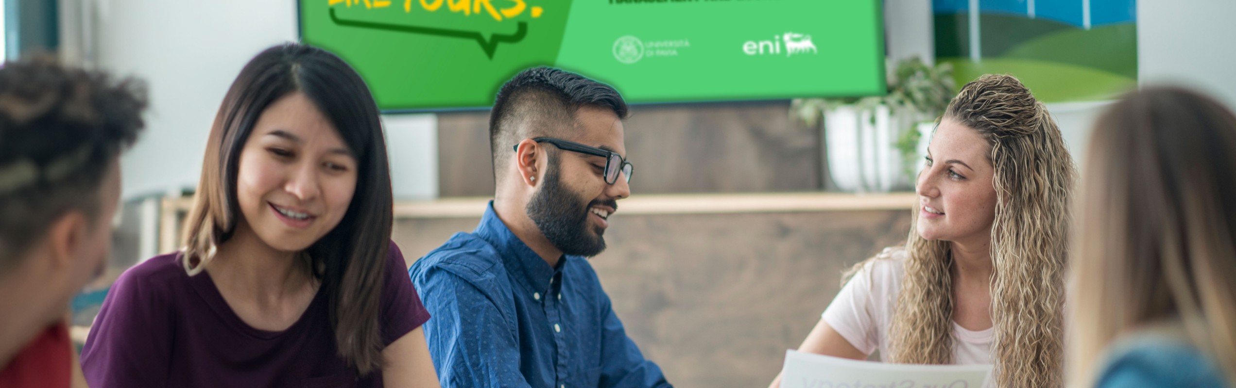 Students compare themselves under the MEDEA Master's poster