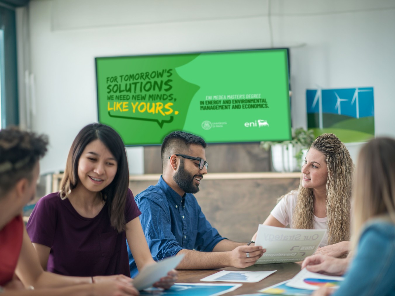 Students compare themselves under the MEDEA Master's poster