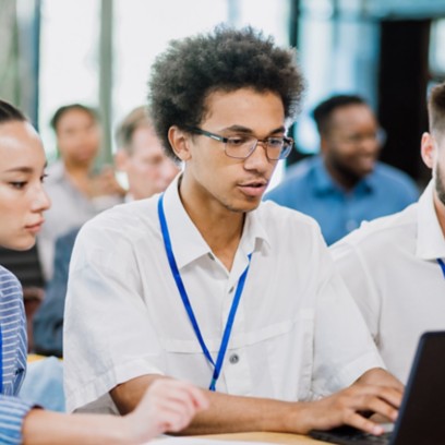 Young students work in front of the computer