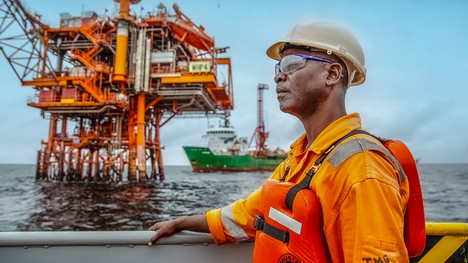 worker on the ship looking at the horizon