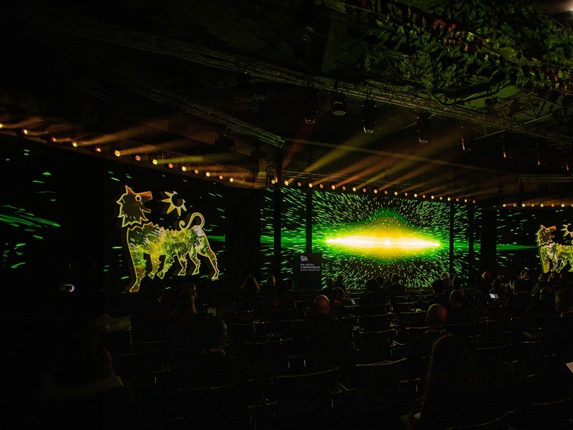 Plenitude event with logo projected on screens
