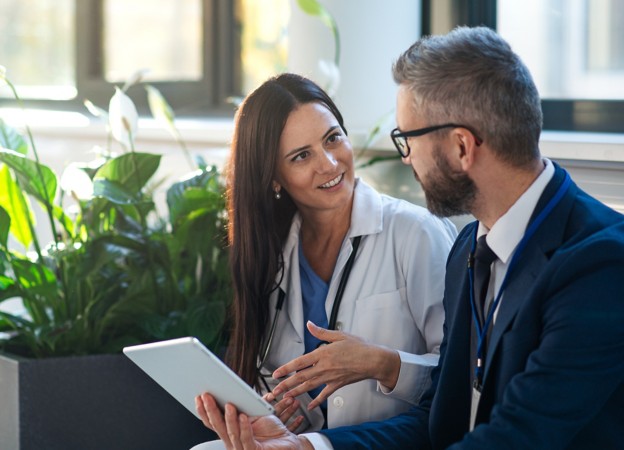 Woman and businessman talk in the office