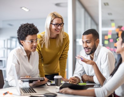 Working group sitting around the table in the office 