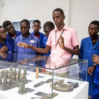 Congolese boys inside the museum as they look at artwork