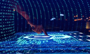 Hand touching an interactive screen with graphics