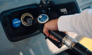 Close-up of a hand refueling with HVO Evolution.