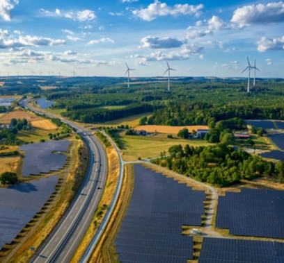 Natural landscape with solar panel and wind power plant road