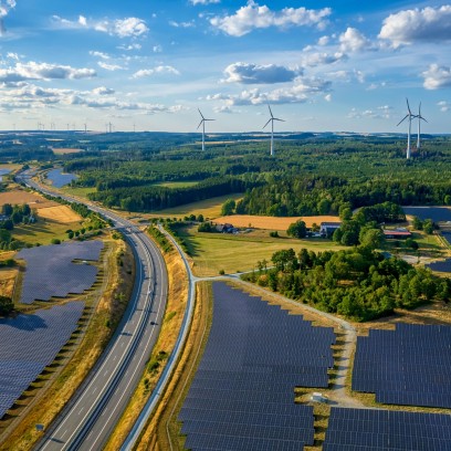 Natural landscape with solar panel and wind power plant road
