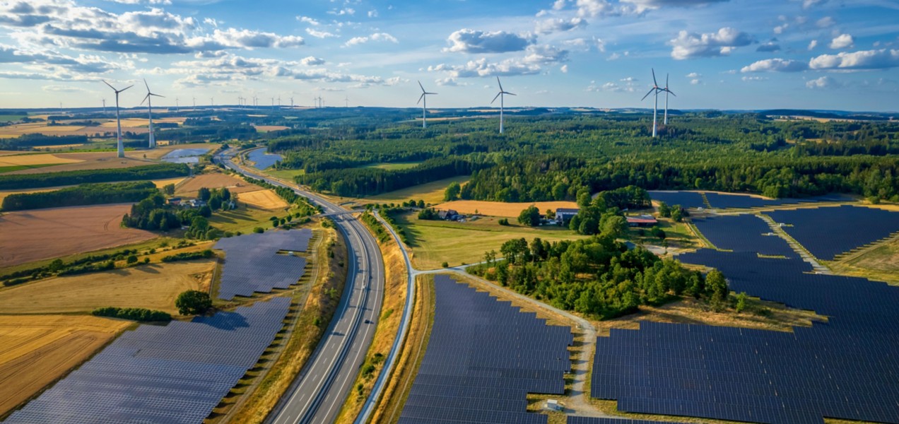 Natural landscape with solar panel and wind power plant road