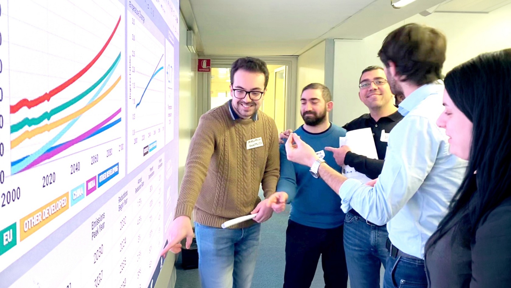 People looking at data on a projection screen