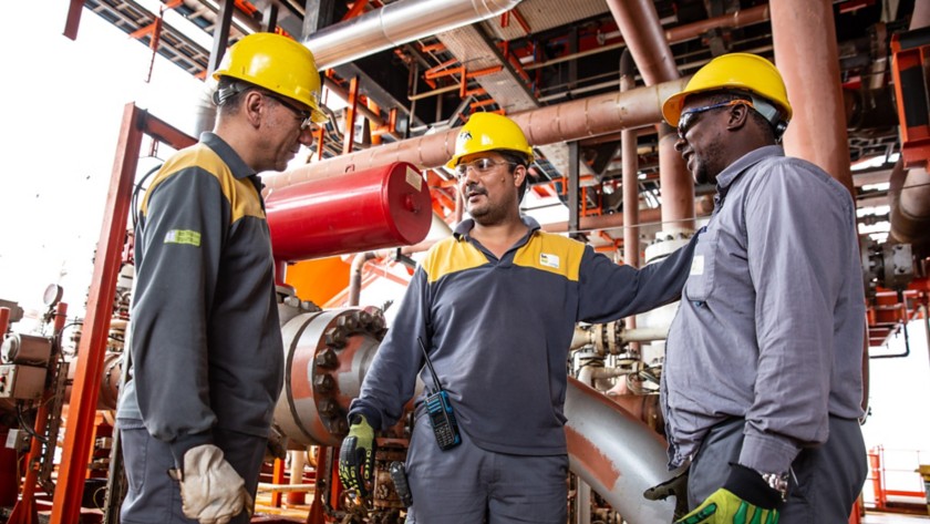 workers talking to each other in the plant