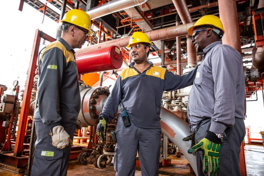 workers talking to each other in the plant