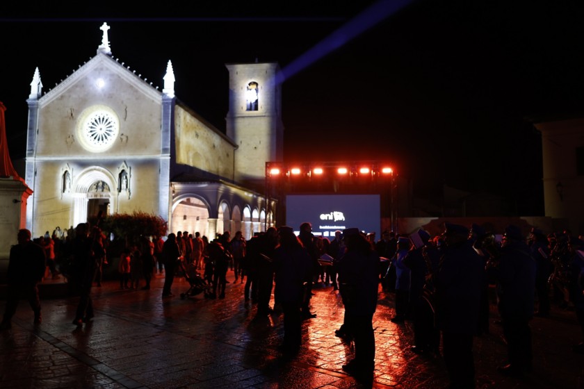The light installation by Eni lit in Piazza San Benedetto with the Basilica in the background