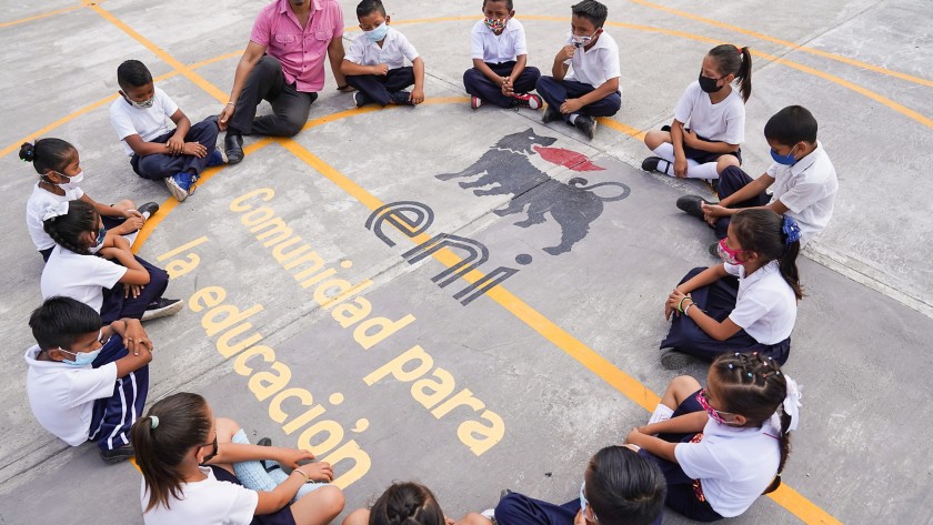 Mexican children run on the basketball court