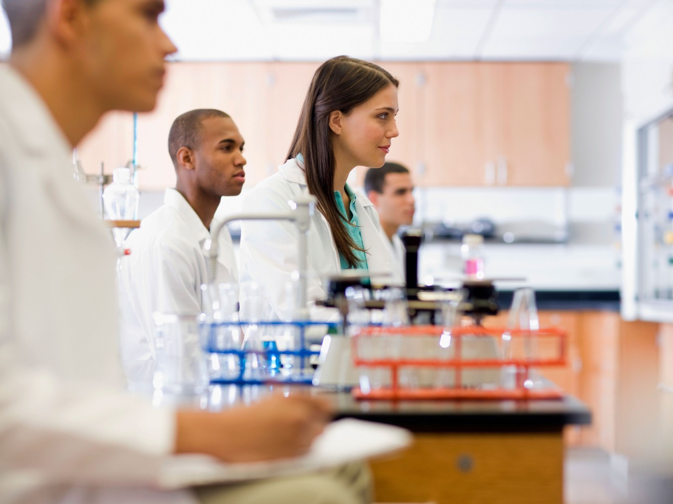 Group of young scientists in the lab during a lecture