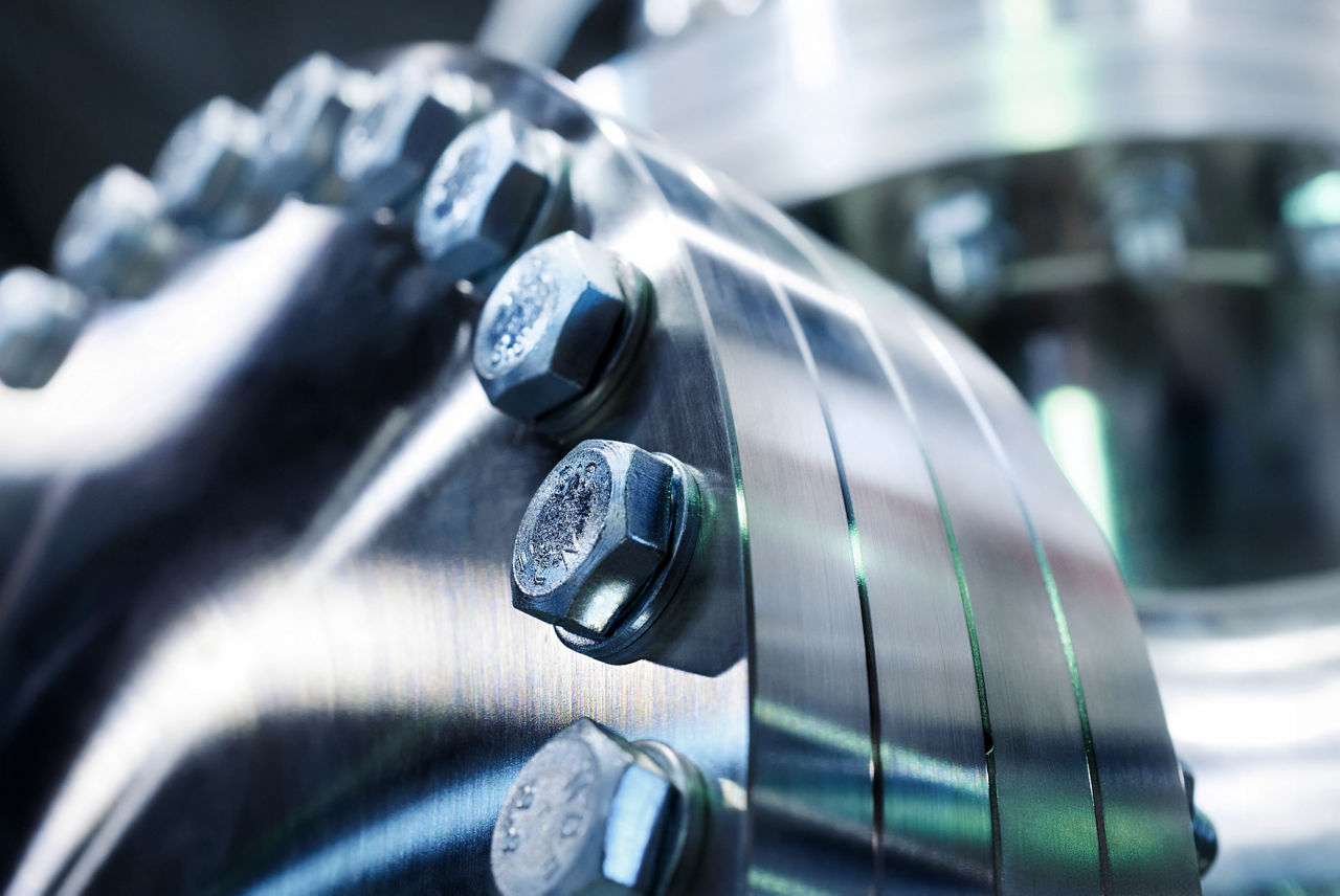 Flanged vacuum equipment. Shiny metal surface. A metal surface treated.