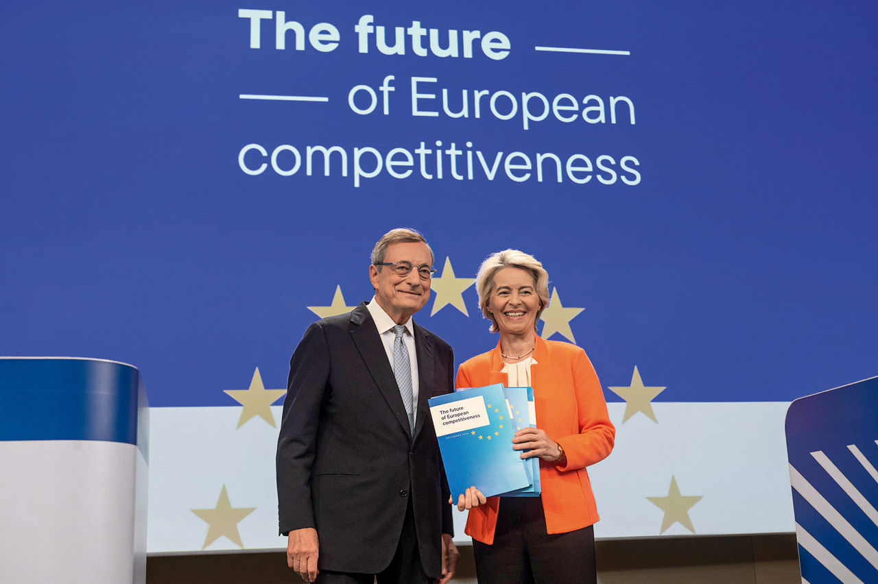 Mario Draghi and Ursula von der Leyen stand in front of a wall with the words “The future of European competitiveness” written on it.