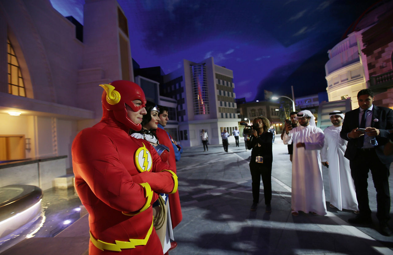 The characters Flash, Wonder Woman and Superman pose for a photo at the theme park Warner Bros. World in Abu Dhabi.