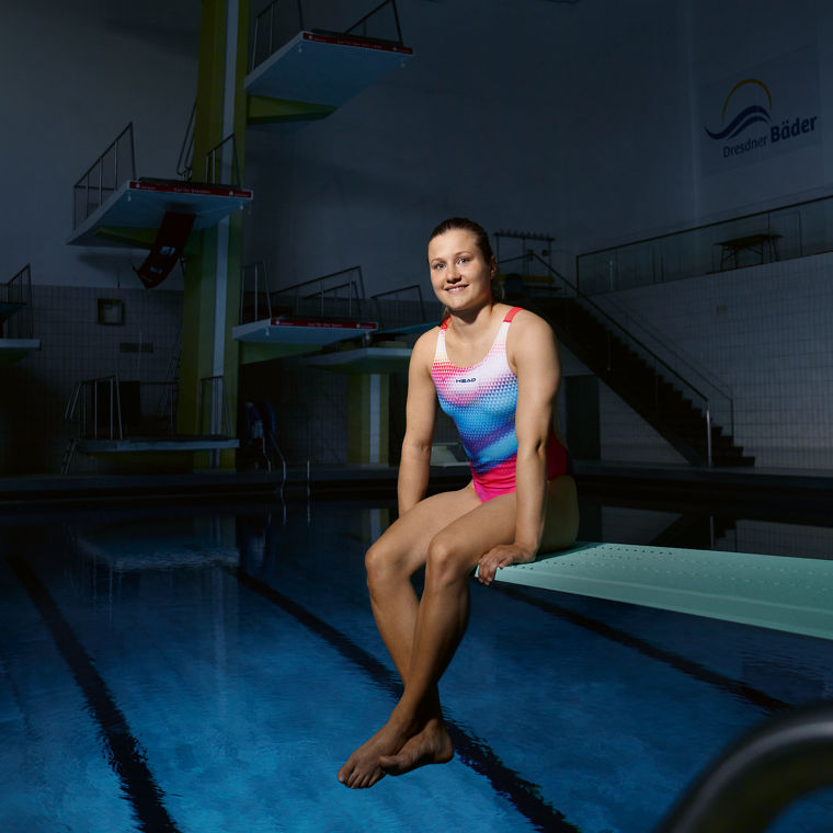 Tina Punzel sits on a diving board.