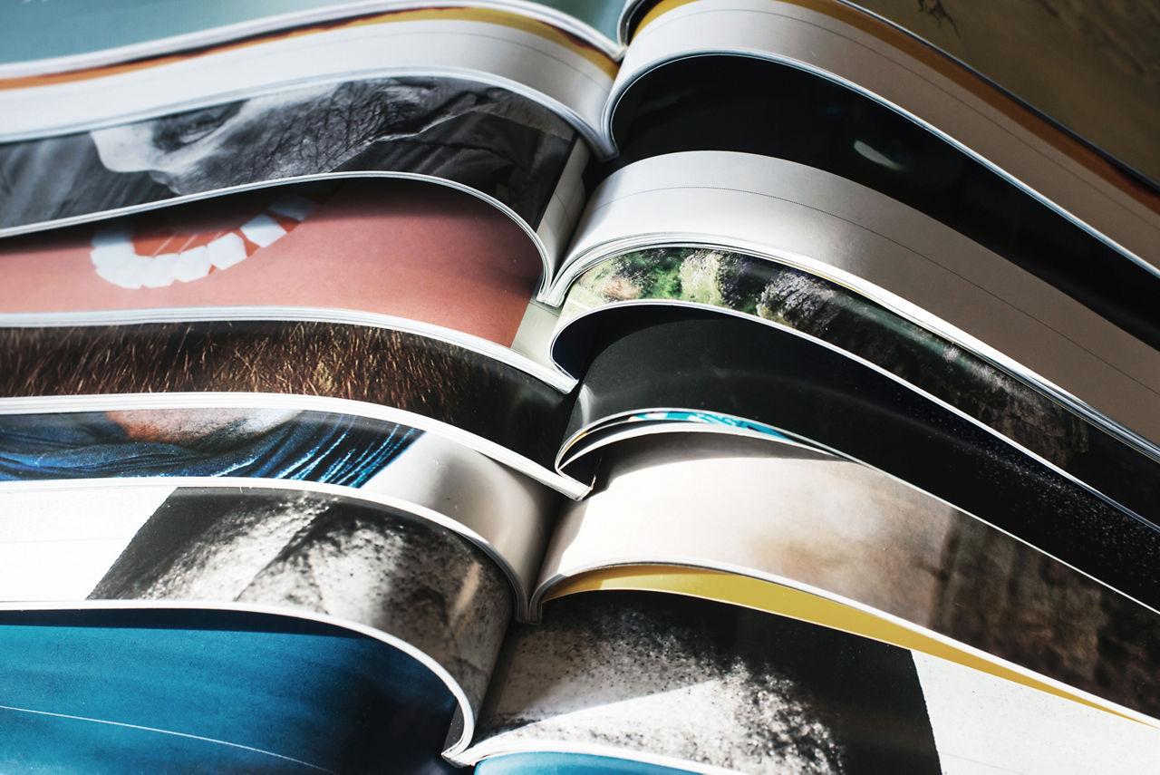 Many opened journals. Sun light.