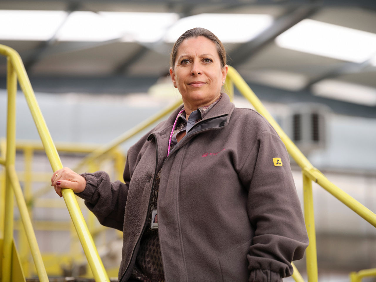 Pilar Honrubia stands on a steel staircase and looks into the camera.
