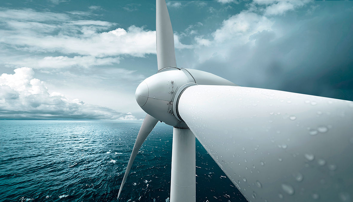 Hurricane impact on renewable energy shown by offshore wind turbine with rain and stormy sea highlighting resilience and challenge