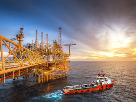 Drilling rig and supply ship in the gulf