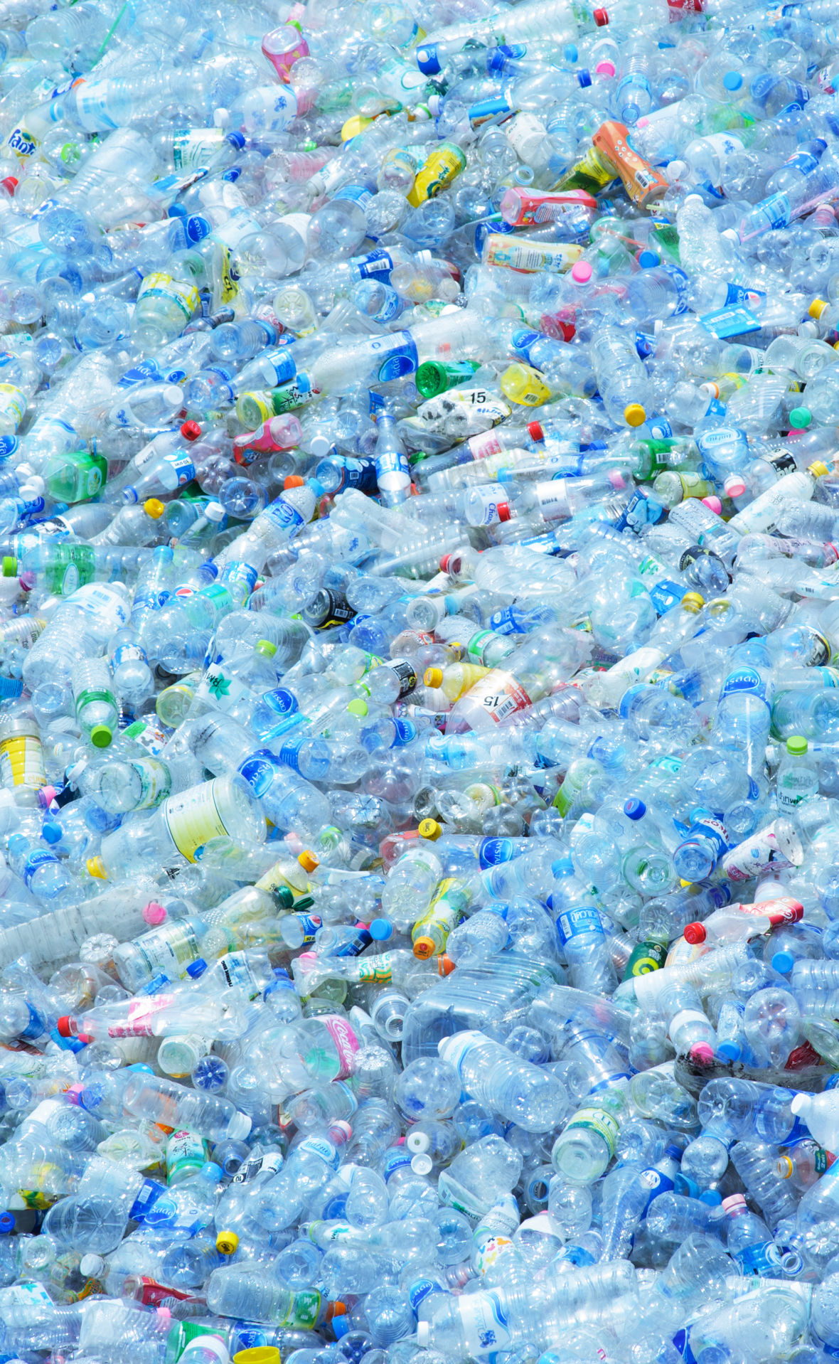 Large pile of plastic bottles for recycling.