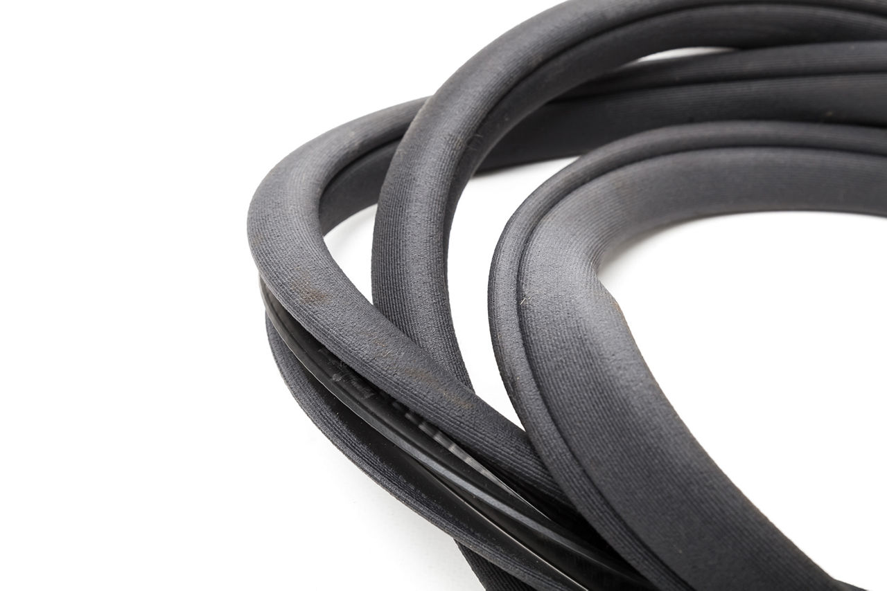 Rolled up black rubber sealant for elements of the car body, doors or trunk, for noise insulation, thermal and sound, preventing heat loss in the car interior. Sealing gasket for repair in a workshop.