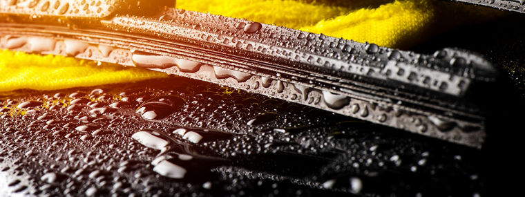 Closeup modern style of car windshield wiper.