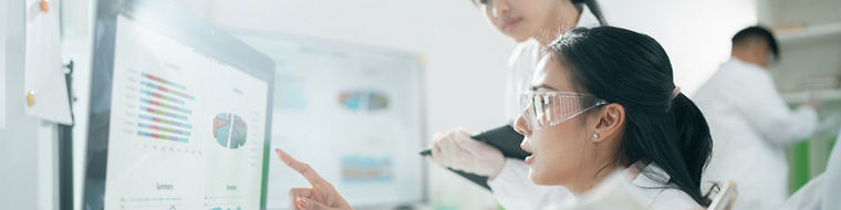 Scientists analyzing data results on laboratory computer monitors, focusing on research, innovation, experiment, teamwork, and biotechnology in modern lab environments for scientific development