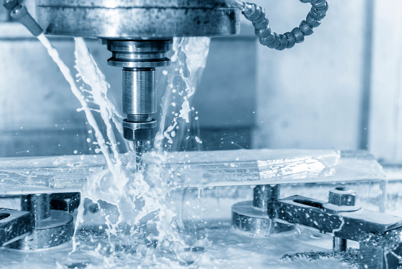 The  CNC milling machine cutting the mould part with the solid ball end mill tool and cooling by coolant fluid.The hi-Technology manufacturing process.