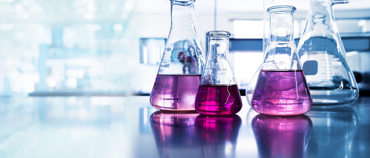 purple glass flask in blue research chemistry science banner laboratory background 